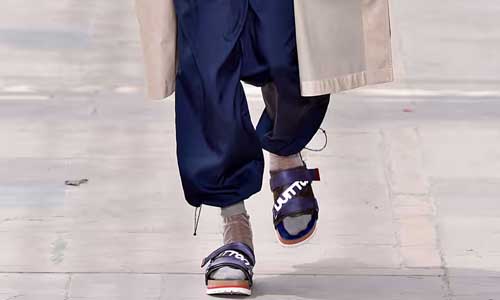 man wearing socks with slippers